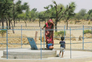 Women using Community Rain Water Harvesting Tank at Dhar Ki Dhani