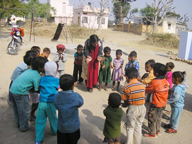 Lady facilitator conducts activities with Balwadi Children